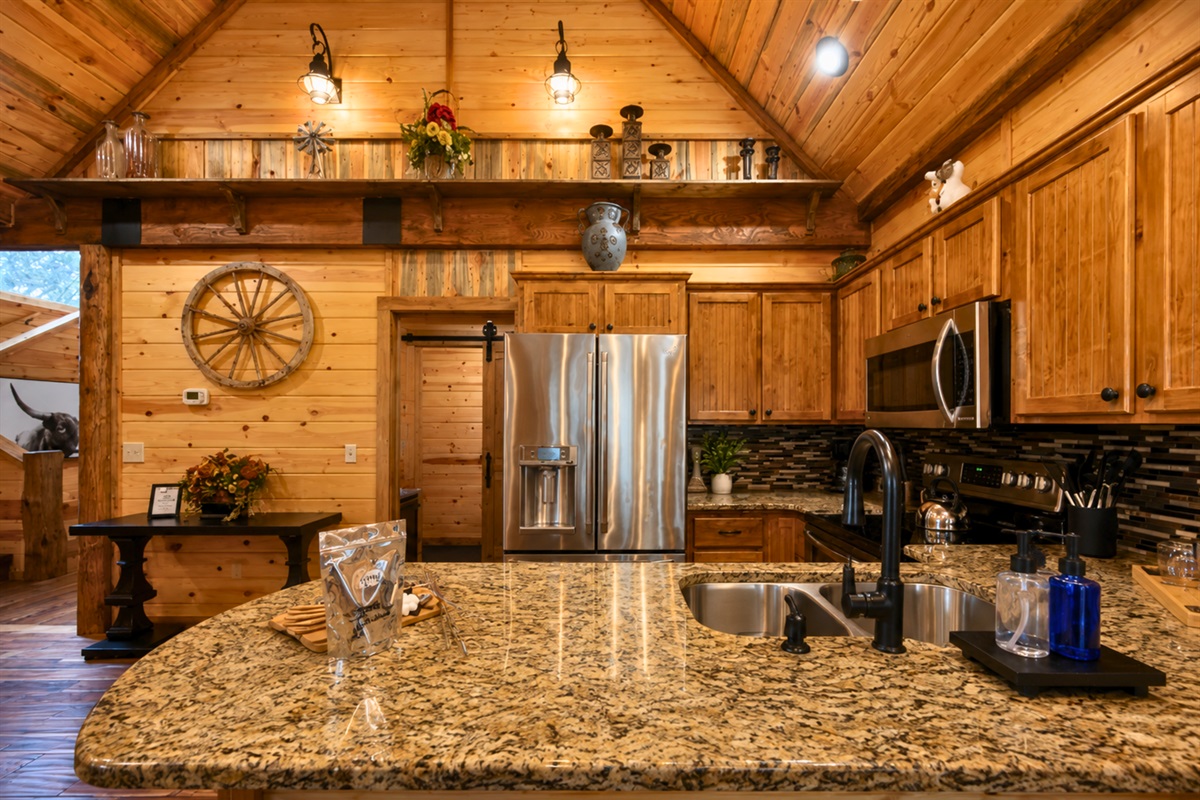 Gathering in the kitchen feels effortless with granite countertops, rustic finishes, and an open layout designed for spending time together.