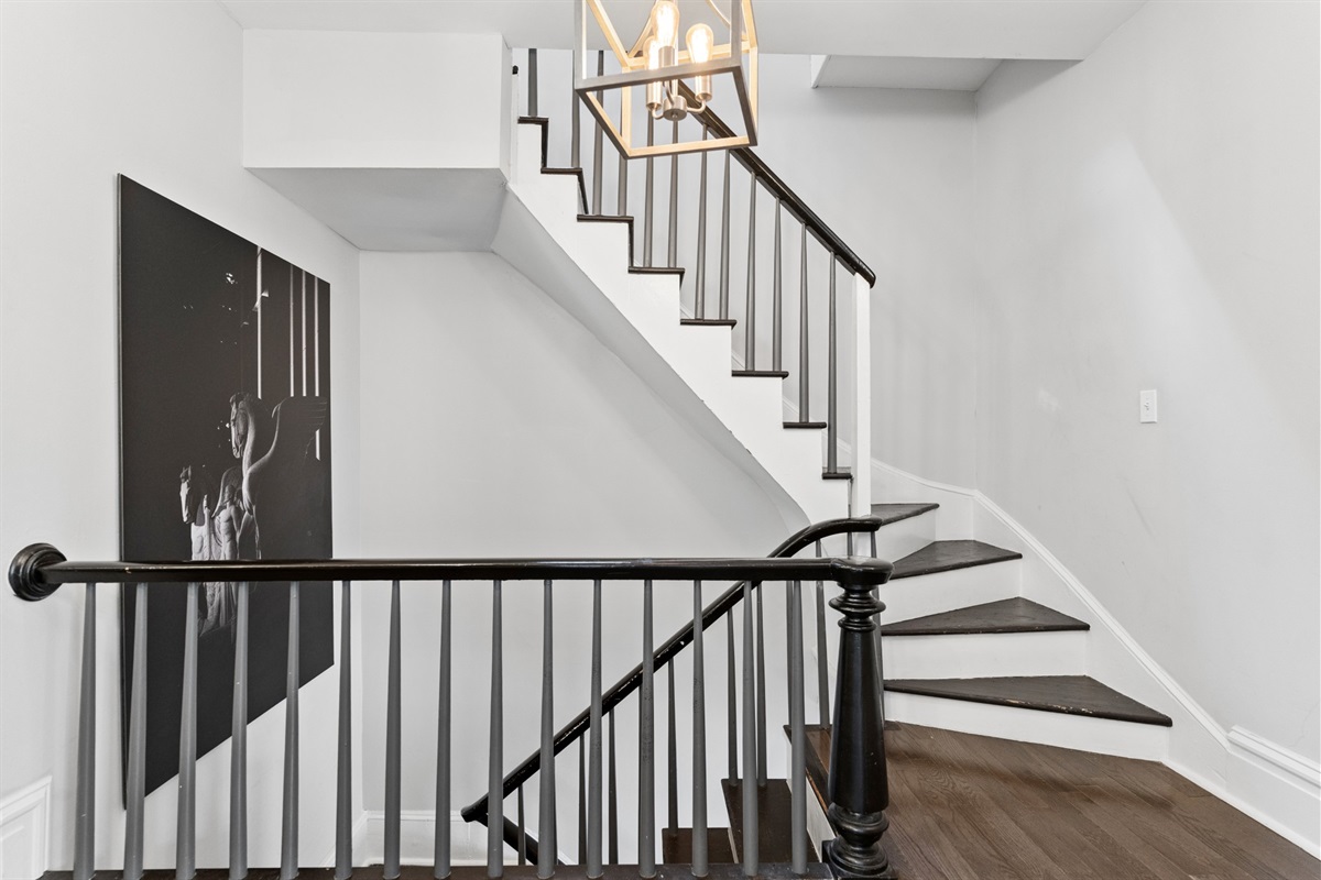 The original staircase showcases the historic character of this 1890 Benton Park home.