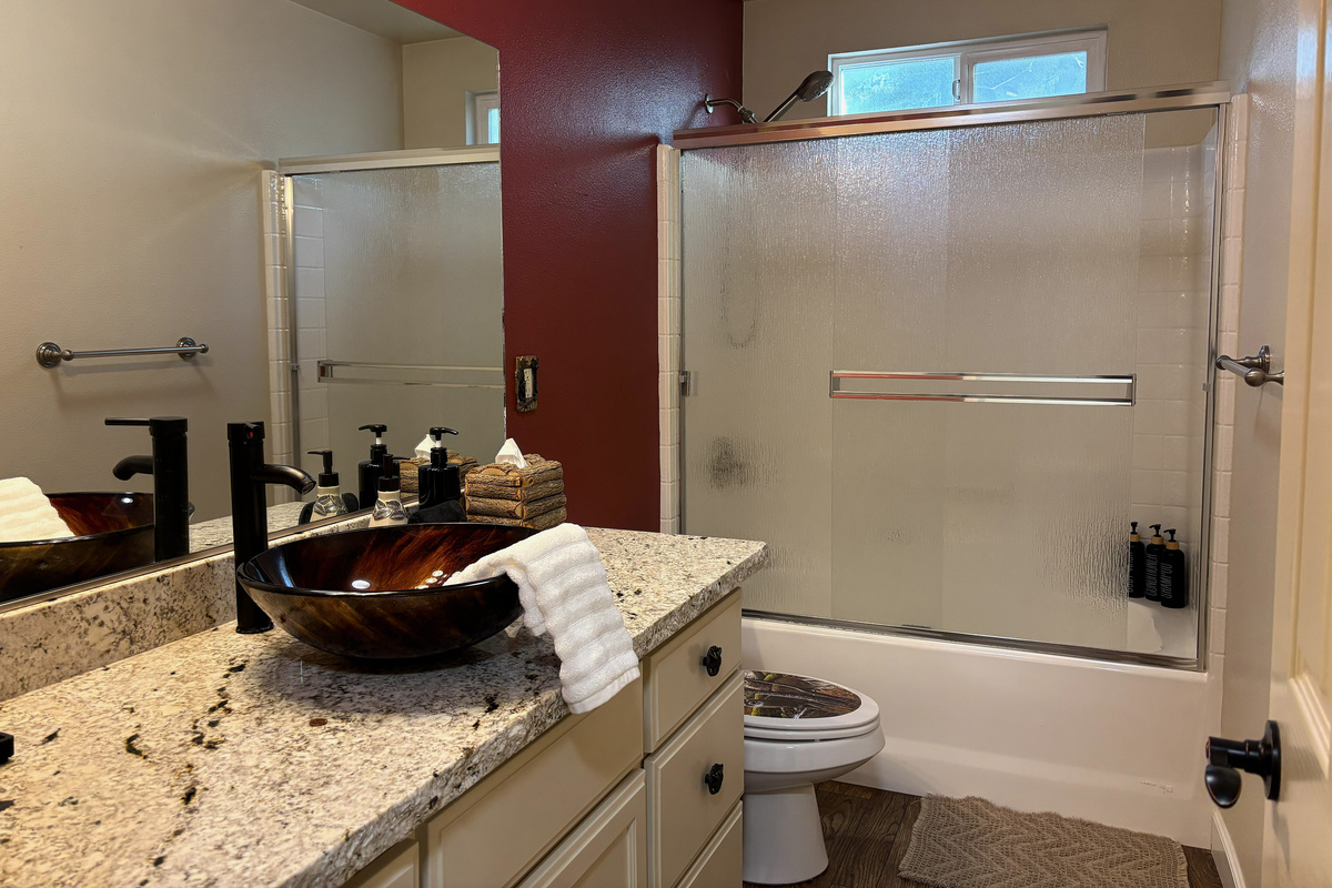 The second bathroom is spacious, perfect for sharing. 