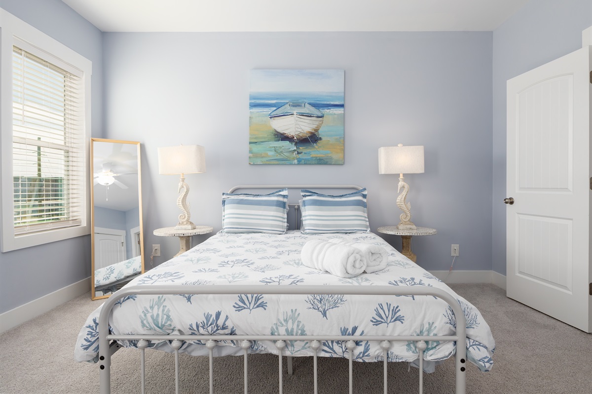 Comfortable Queen bed positioned as the main sleeping area, perfect for a restful night&rsquo;s sleep