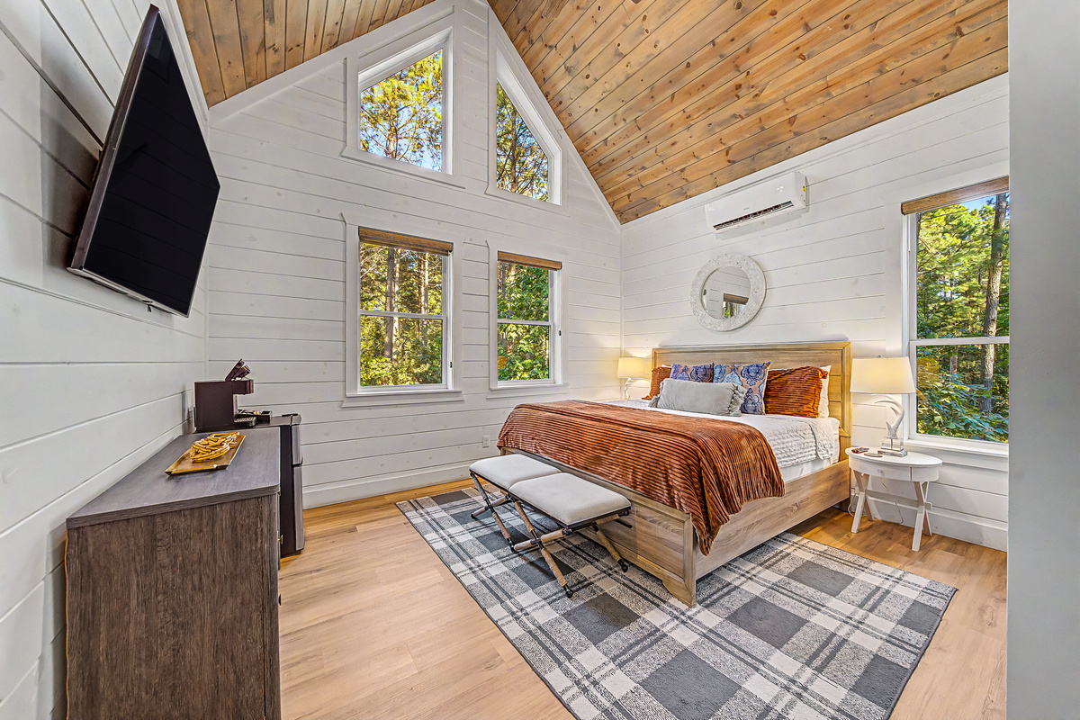 One of two private king bedroom pods — an adult retreat away from the main gathering spaces. Both have their own coffee station and drink fridge for slow mornings without leaving your pod.
