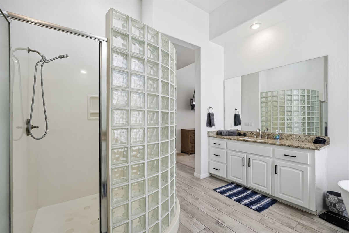 En-suite with large tub and walk-in shower.