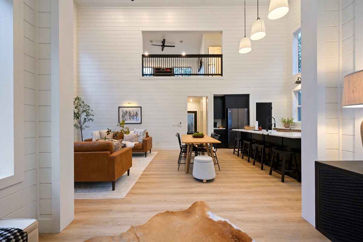 Contemporary lighting and curated finishes give the kitchen a sophisticated yet cozy cabin vibe.