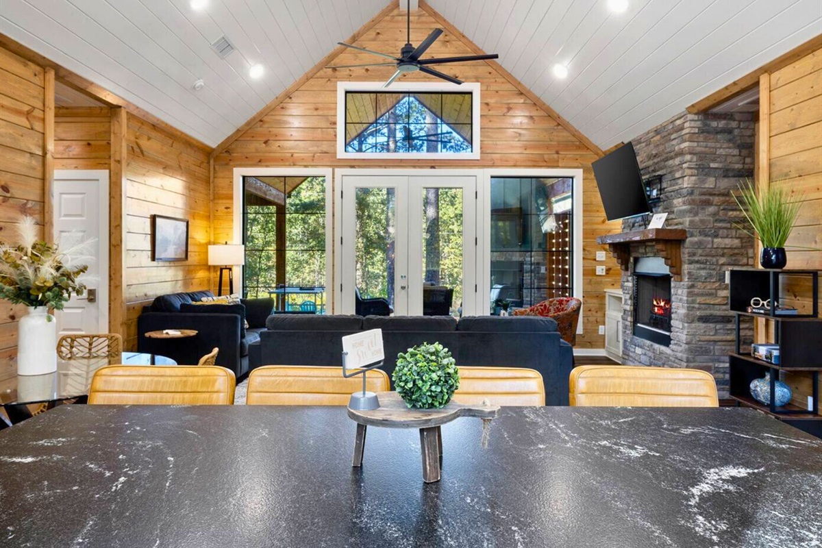 Style and comfort converge in this spacious living room, your woodland retreat