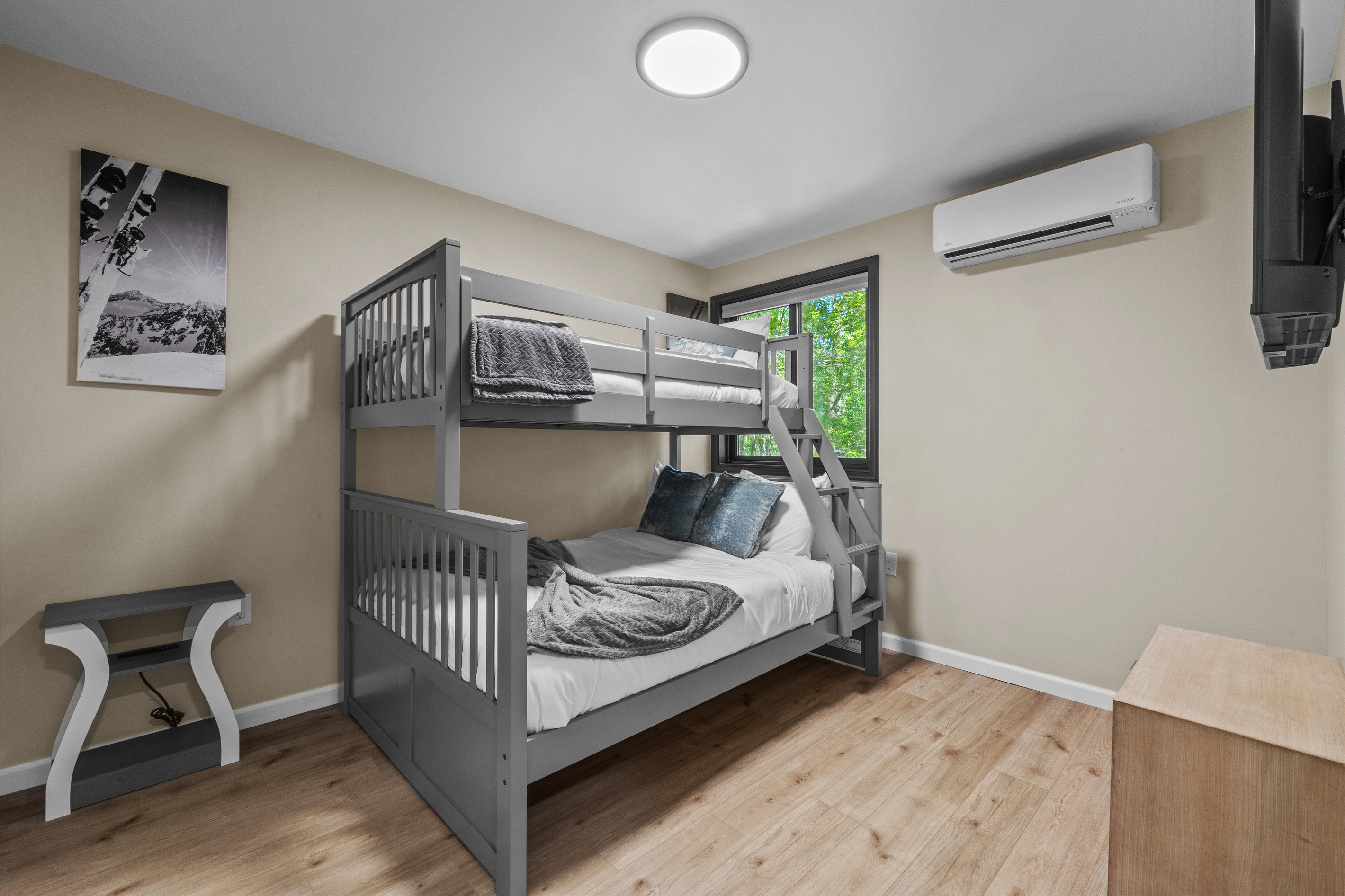 A sturdy Twin-over-Full bunk bed configuration, providing flexible sleeping options for both adults and children.