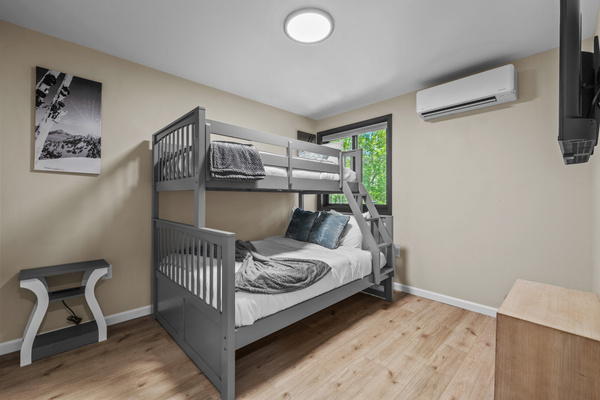 A sturdy Twin-over-Full bunk bed configuration, providing flexible sleeping options for both adults and children.