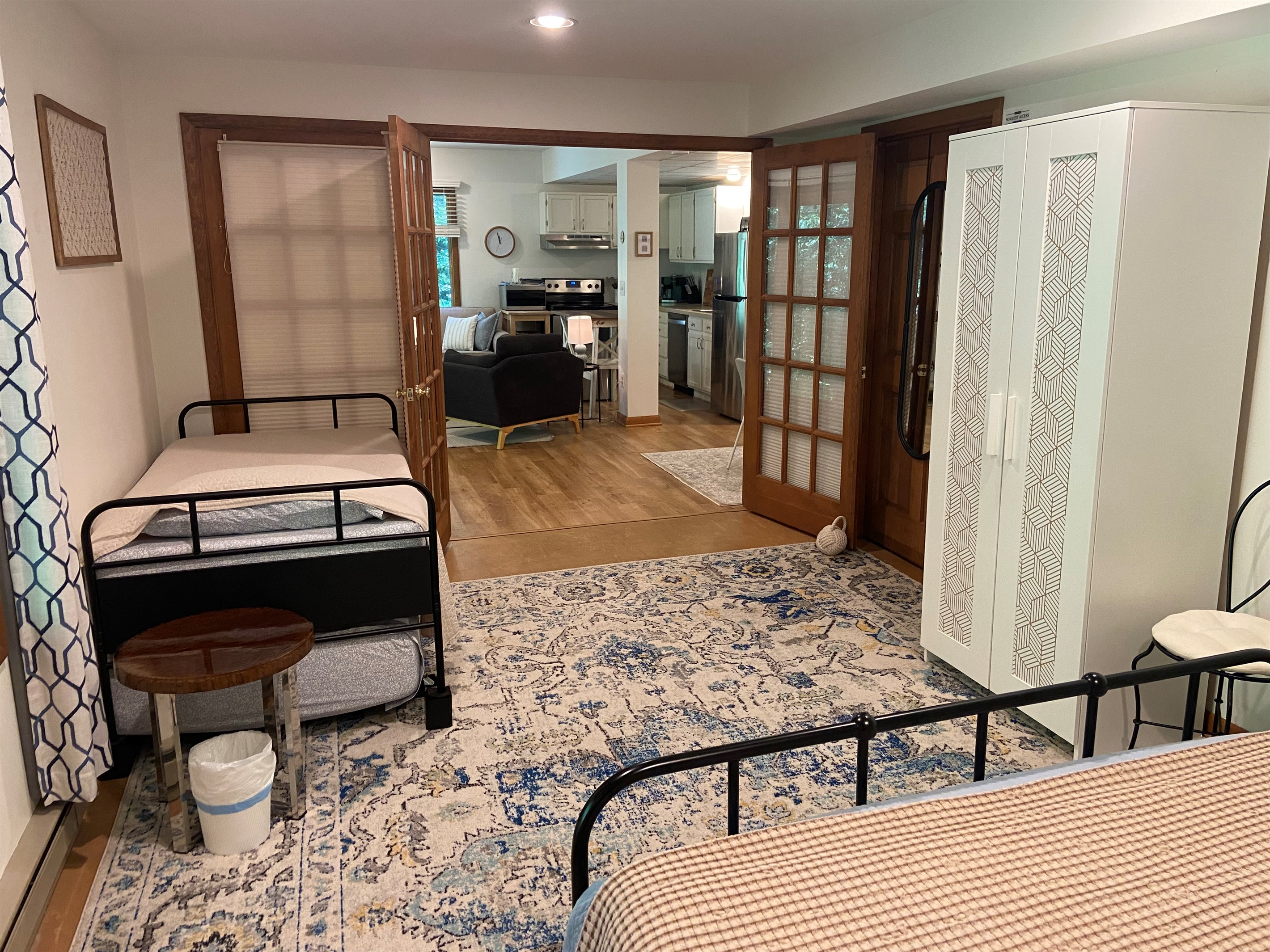 View from queen bed into rest of bedroom and into the living room