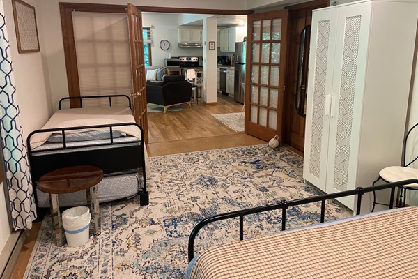 View from queen bed into rest of bedroom and into the living room