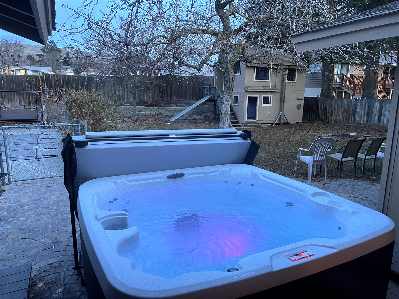 Enjoy the hot tub in the private backyard