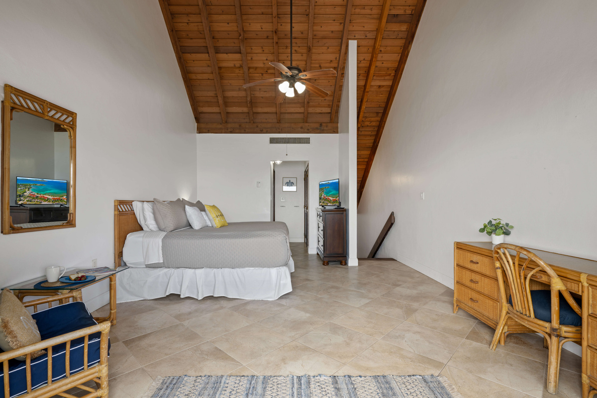 Spacious primary suite designed for peaceful island relaxation.