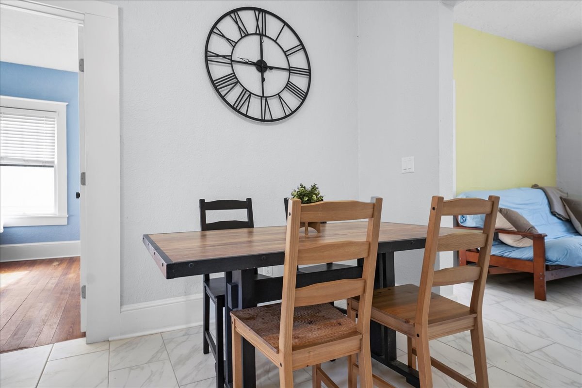 Kitchen table for morning coffee, next to the large futon in the living room