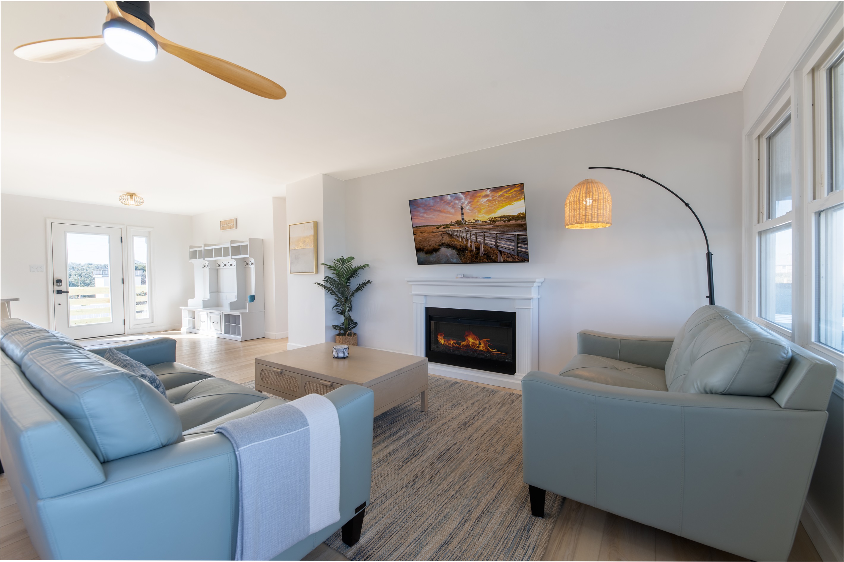 Enjoy the comfortable leather couches when resting from a fun day at the beach!