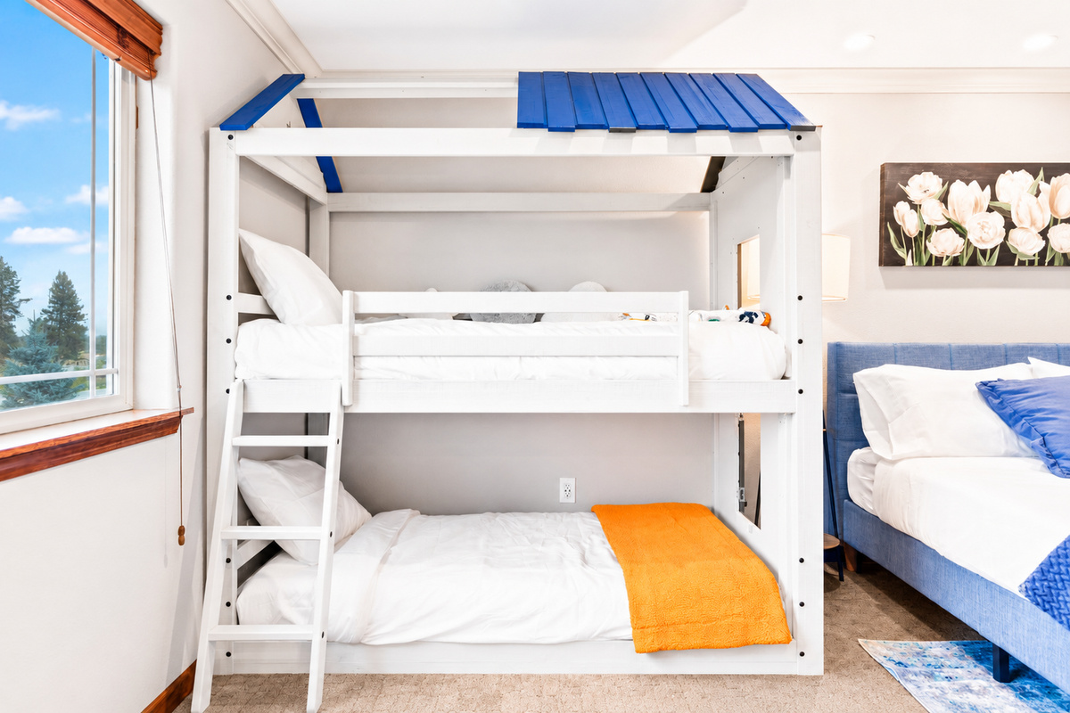 Experience the epitome of family-friendly luxury in our 2ndfloor bedroom. Enjoy the spacious comfort of a queen bed while the kids delight in their playful bunkbeds. With a walk-in closet for added convenience and an ensuite bathroom.