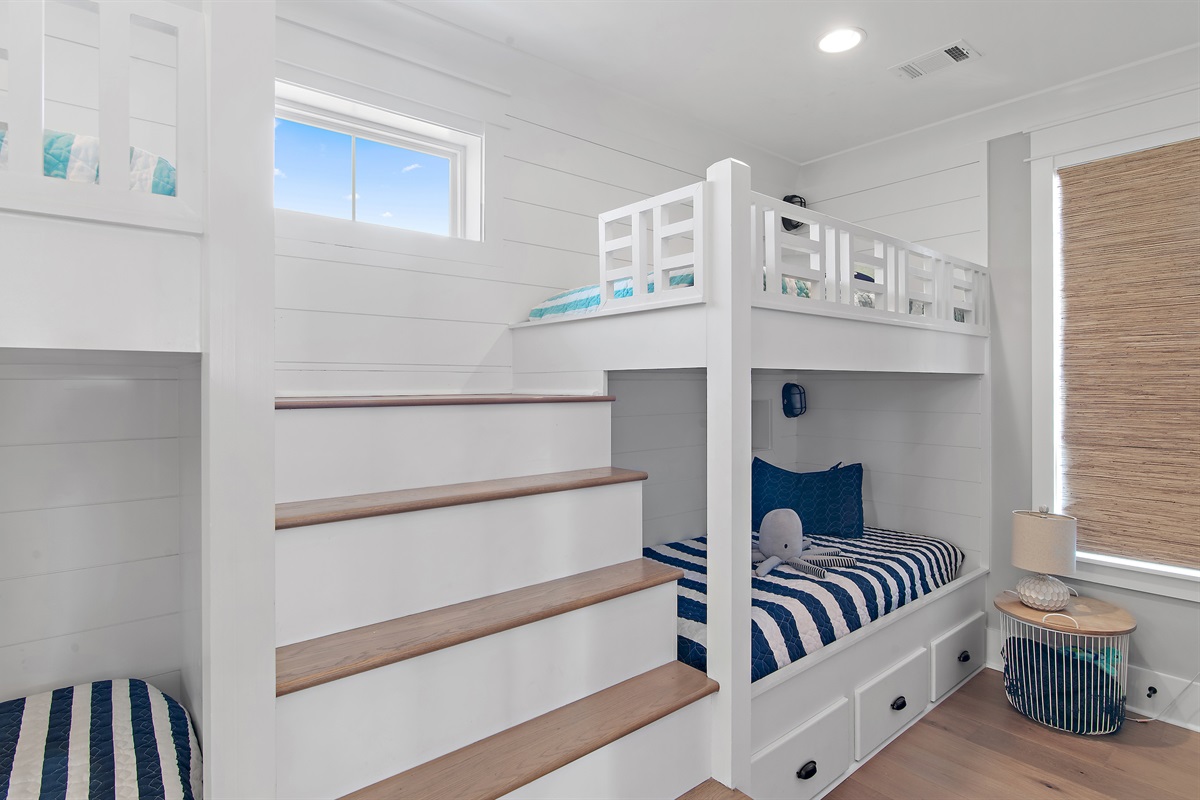 The cutest bunk room with 4 twin beds