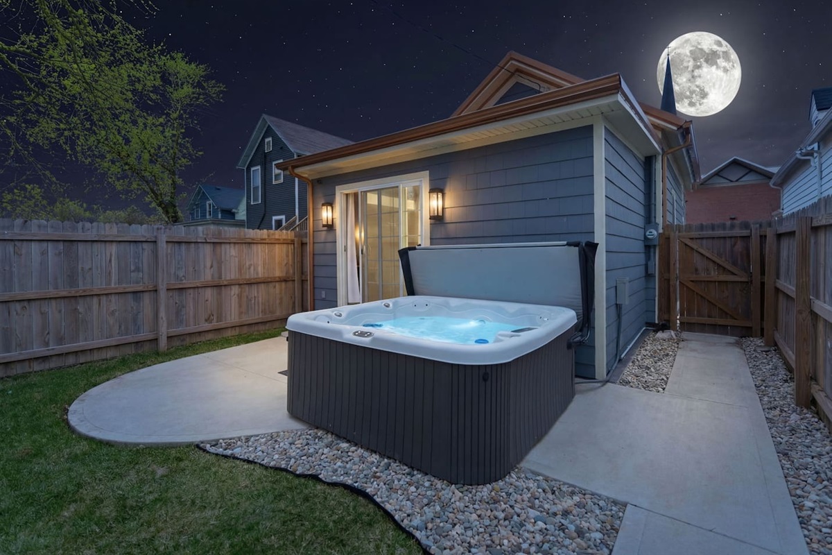 Relax in the private hot tub under the stars for a serene evening experience
Close-up view of the bubbling hot tub, perfect for unwinding after a long da