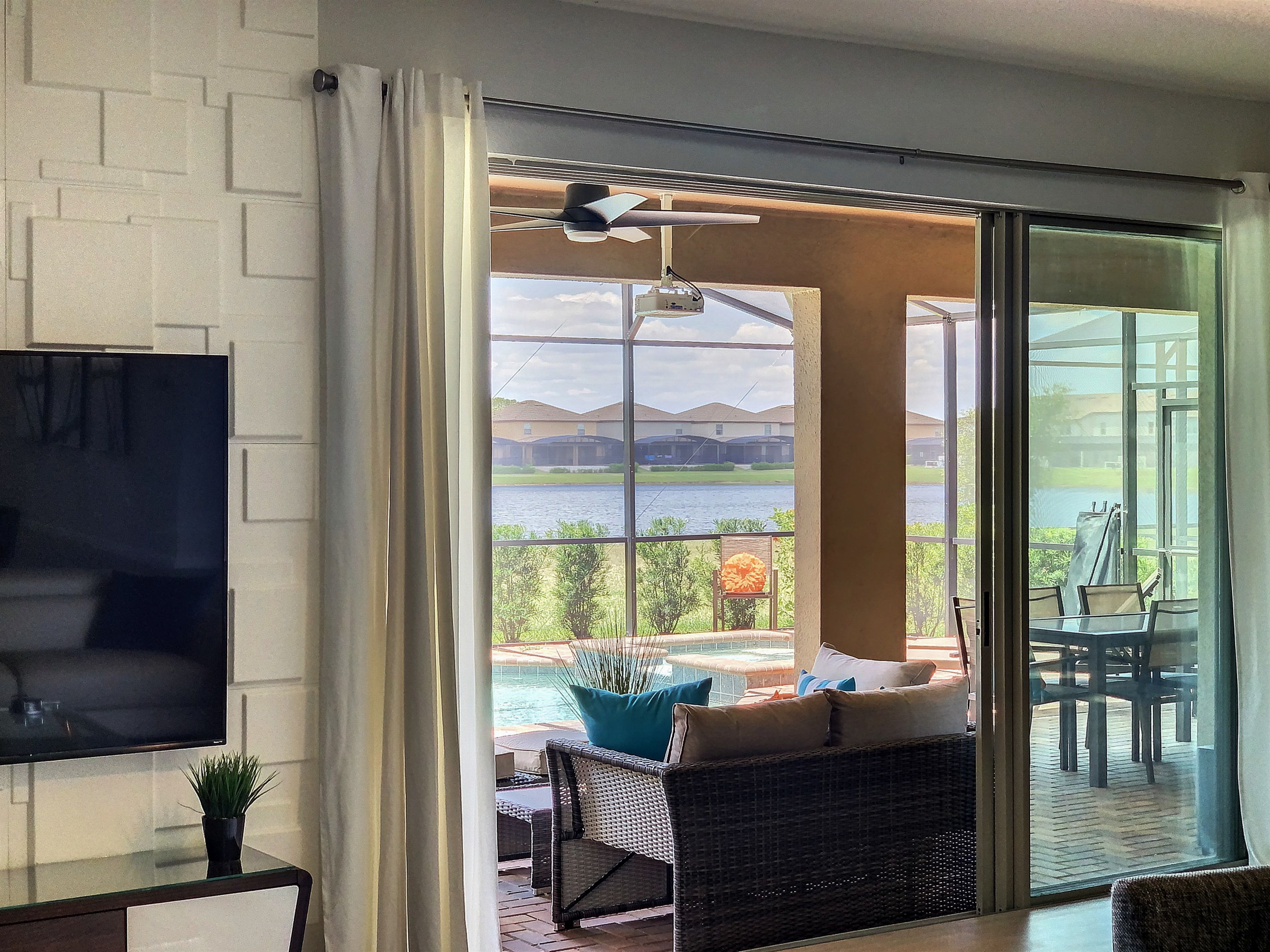 Great View From Living Room Of The Pool And Water Behind