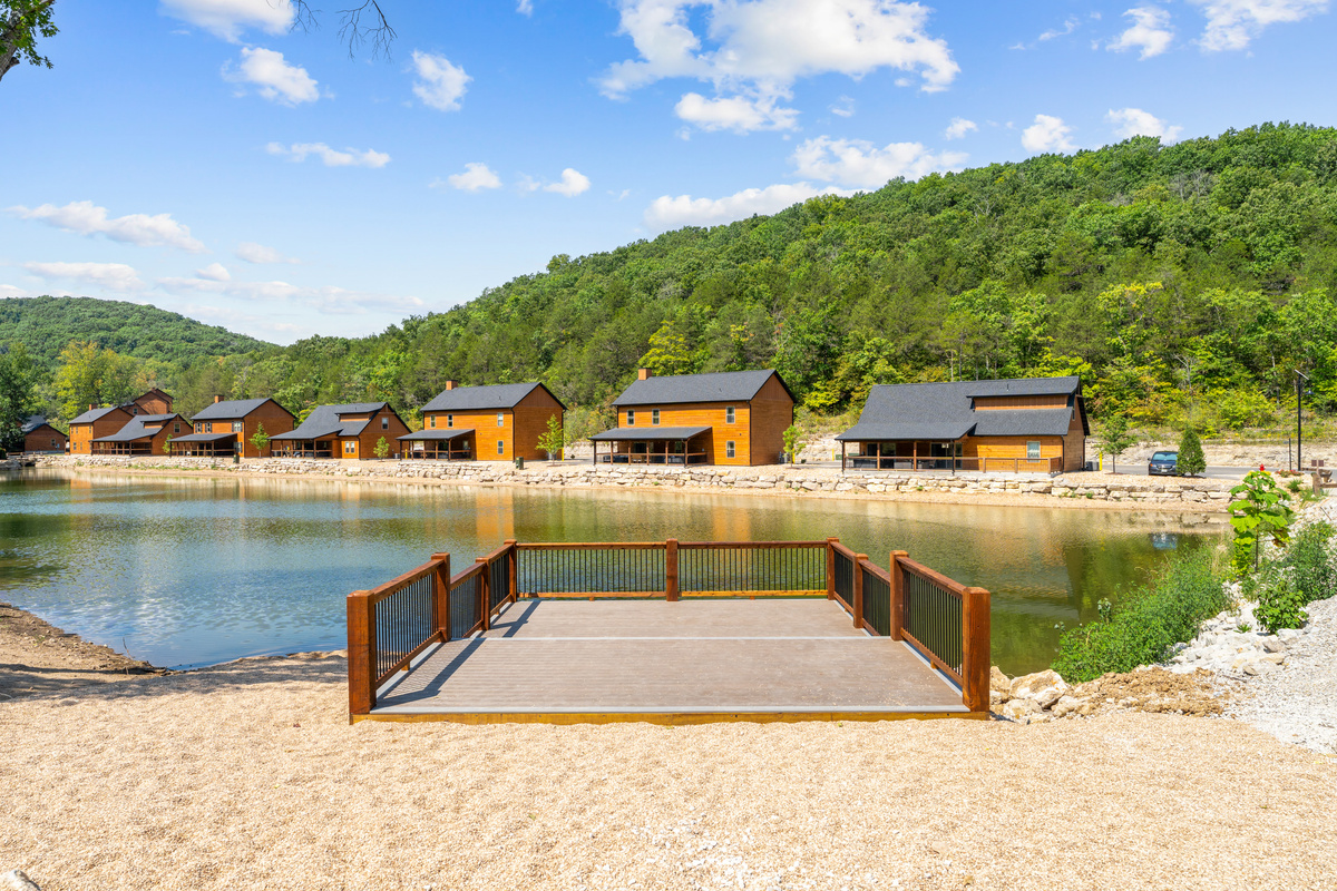 Cast a line for bass and bluegill from the dock on Tall Timbers' stocked fishing lake in Hollister, MO.