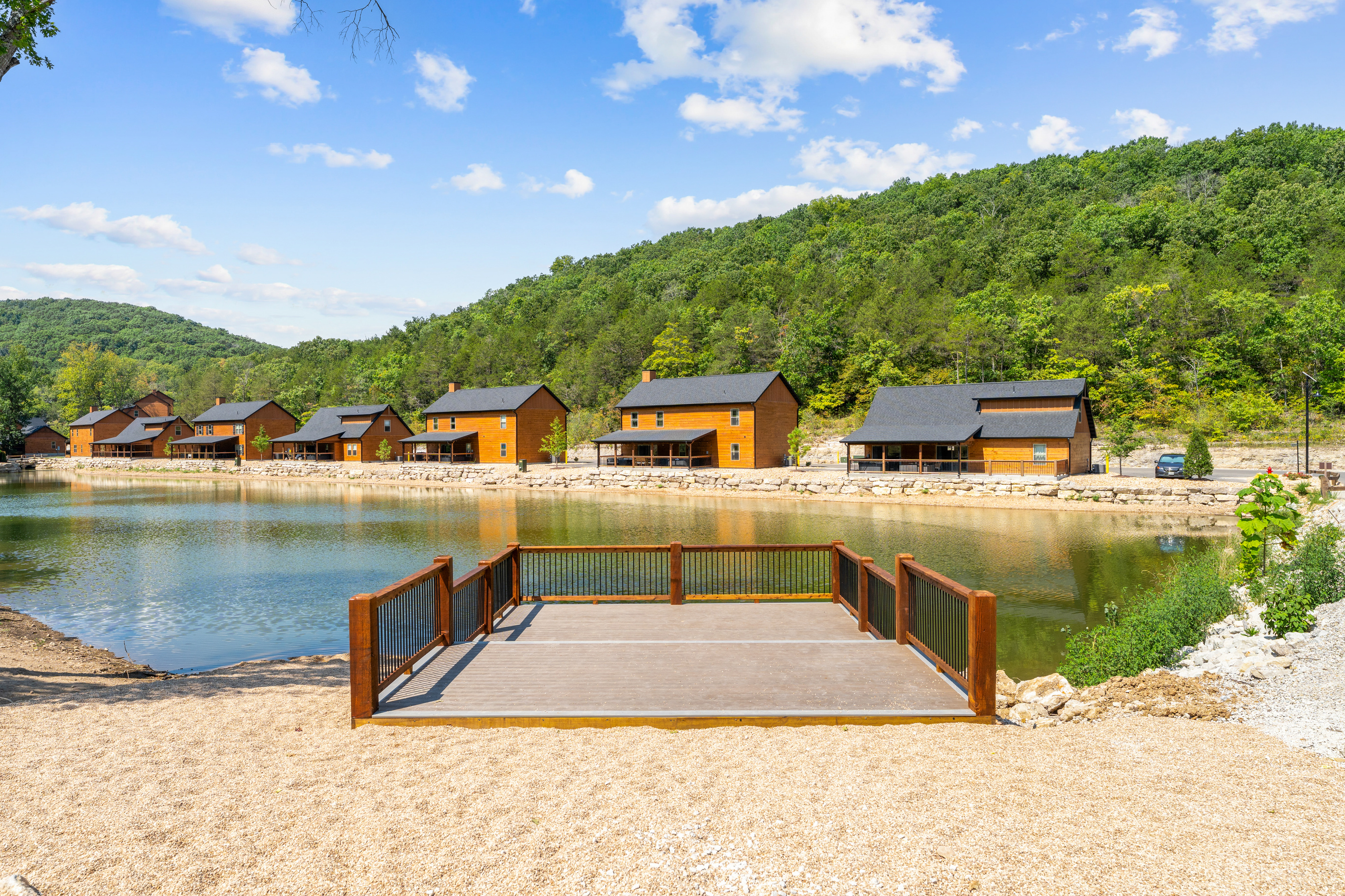 Cast a line for bass and bluegill from the dock on Tall Timbers' stocked fishing lake in Hollister, MO.