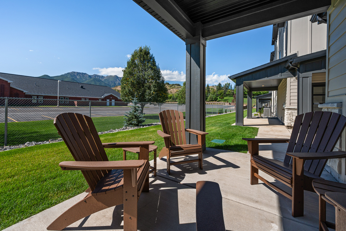 Enjoy outdoor seating outside the home, with a peaceful neighborhood setting and mountain views nearby.