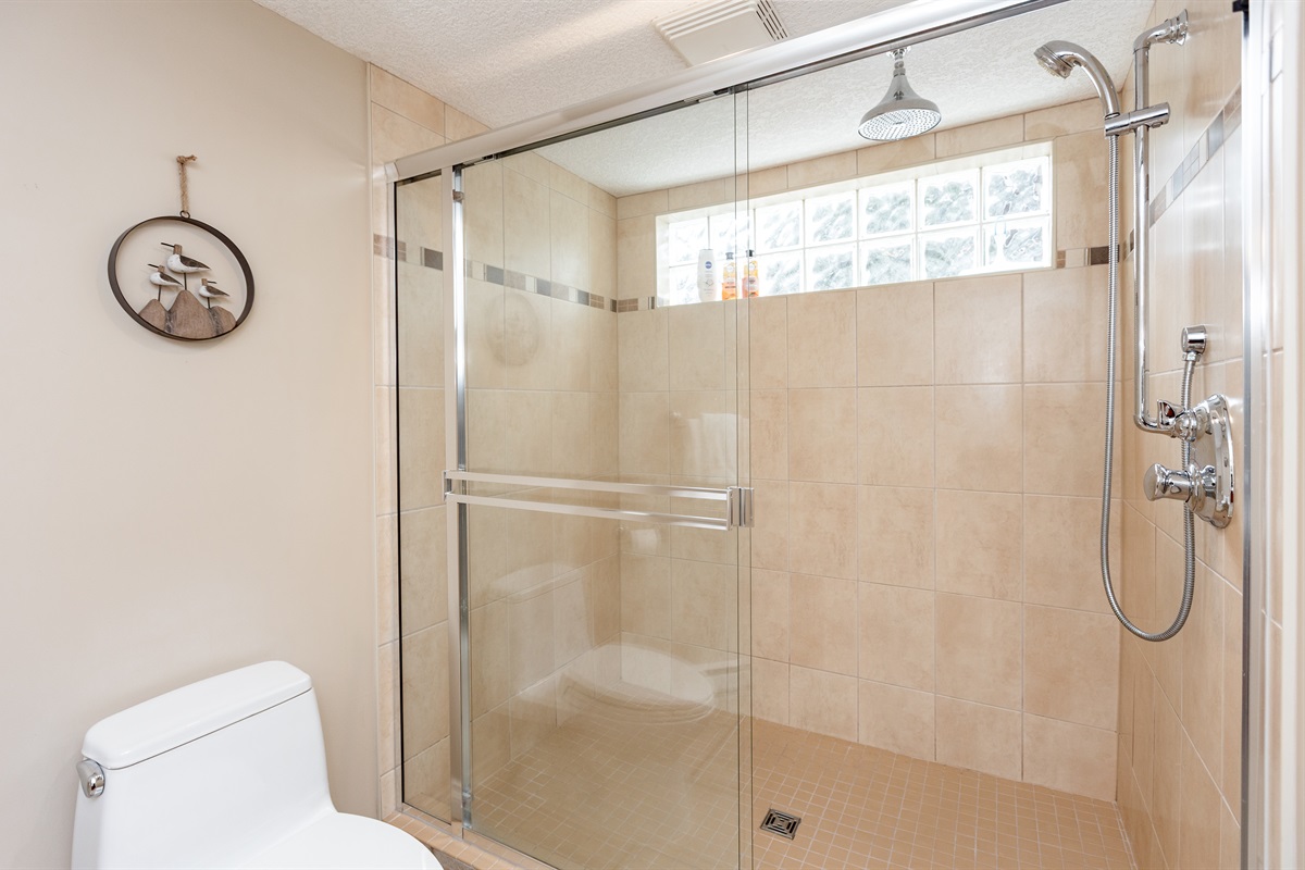 Unit B. Oversized Rain shower! Super large bathroom. Easy to move around. All linens provided. Body soap, shampoo and condtioner provided as well.