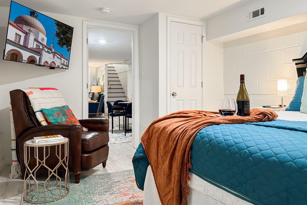 Settle into a lower-level bedroom with its own TV — a private retreat away from the main-floor bustle.