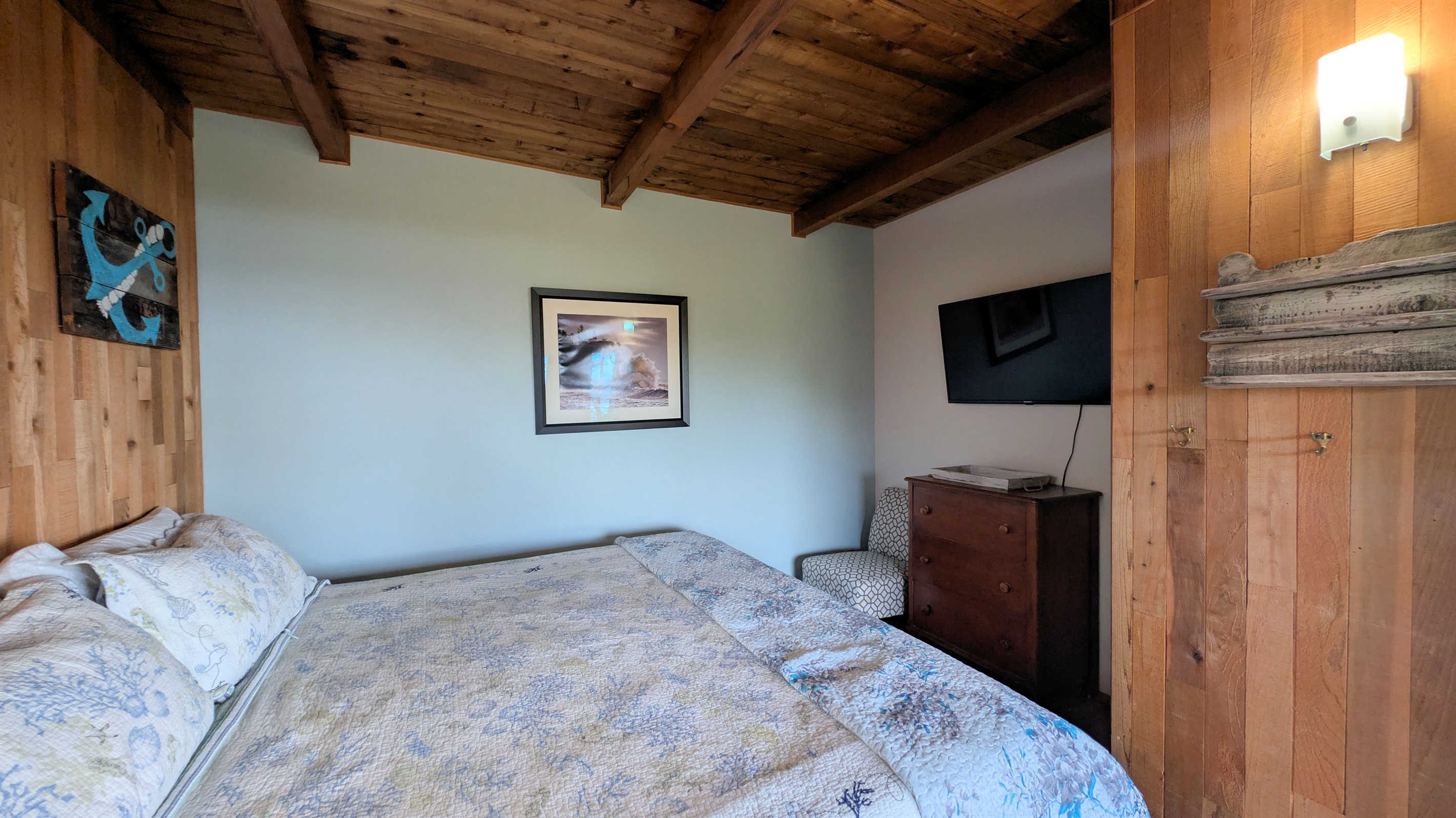 King bedroom off of living room with tV