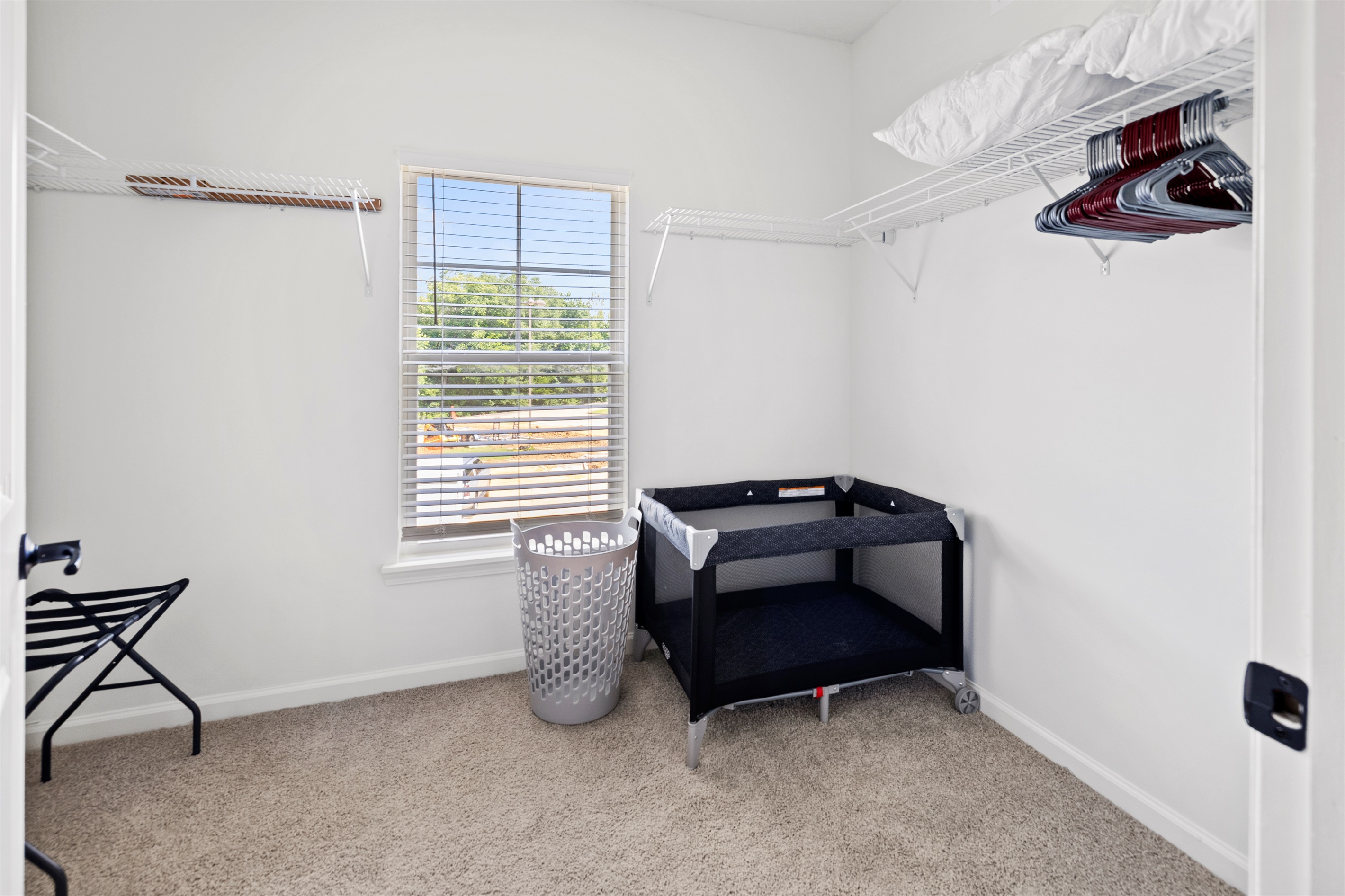 Plenty of closet space for clothes and travel bags. Pack and Play in unit.