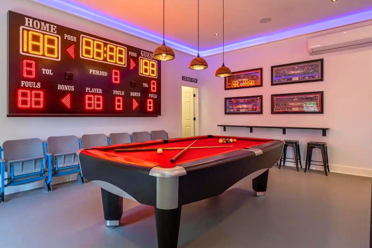 [Game Room] You Will Not Find Another Game Room Like This One! There is a Pool Table, an Electronic Scoreboard, a Central Bar with Seating for 5 and a Mini Fridge.