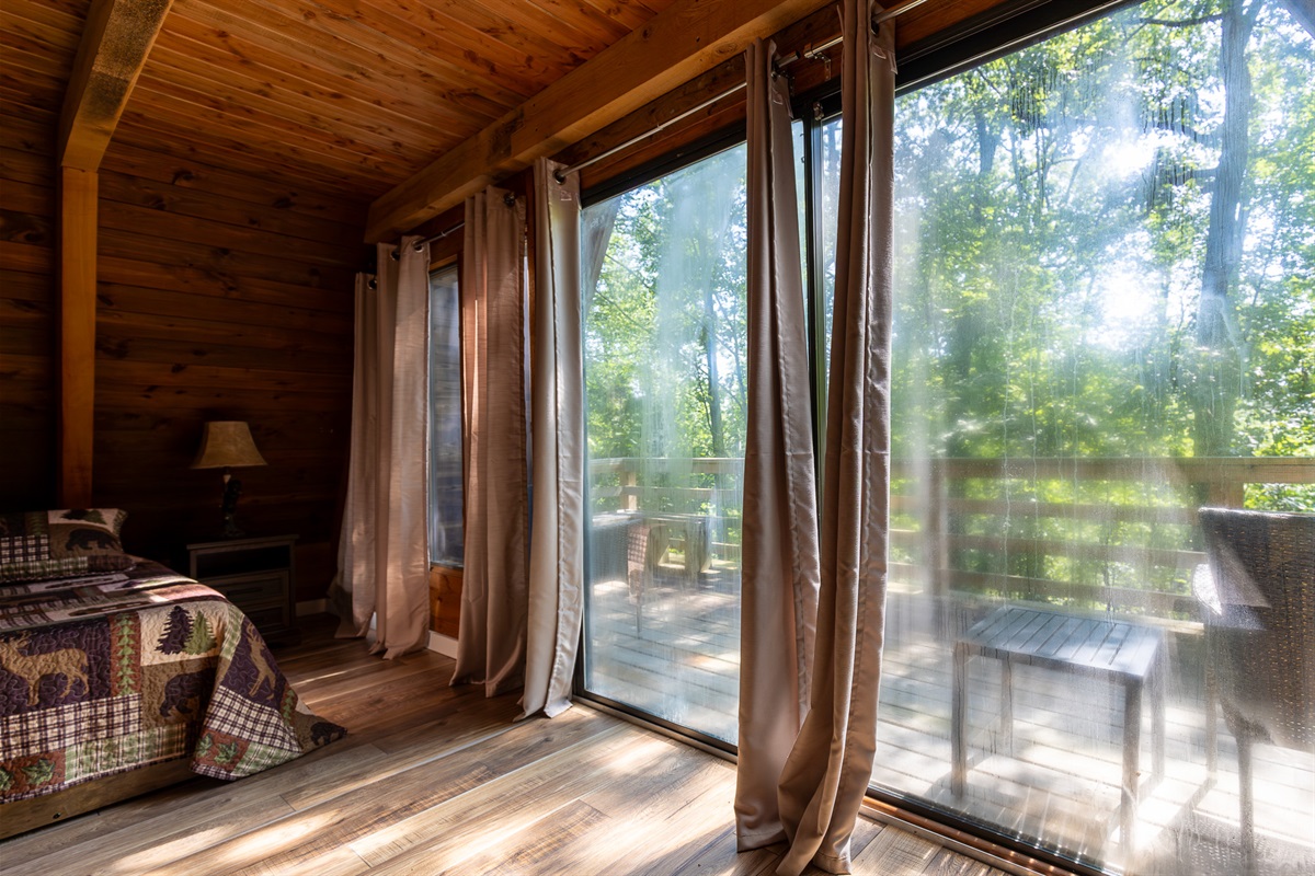 Explore the balcony outside the downstairs sleeping space.