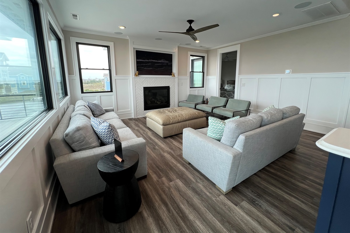 Living area with plenty of views! Doorway to top floor king bedroom suite.