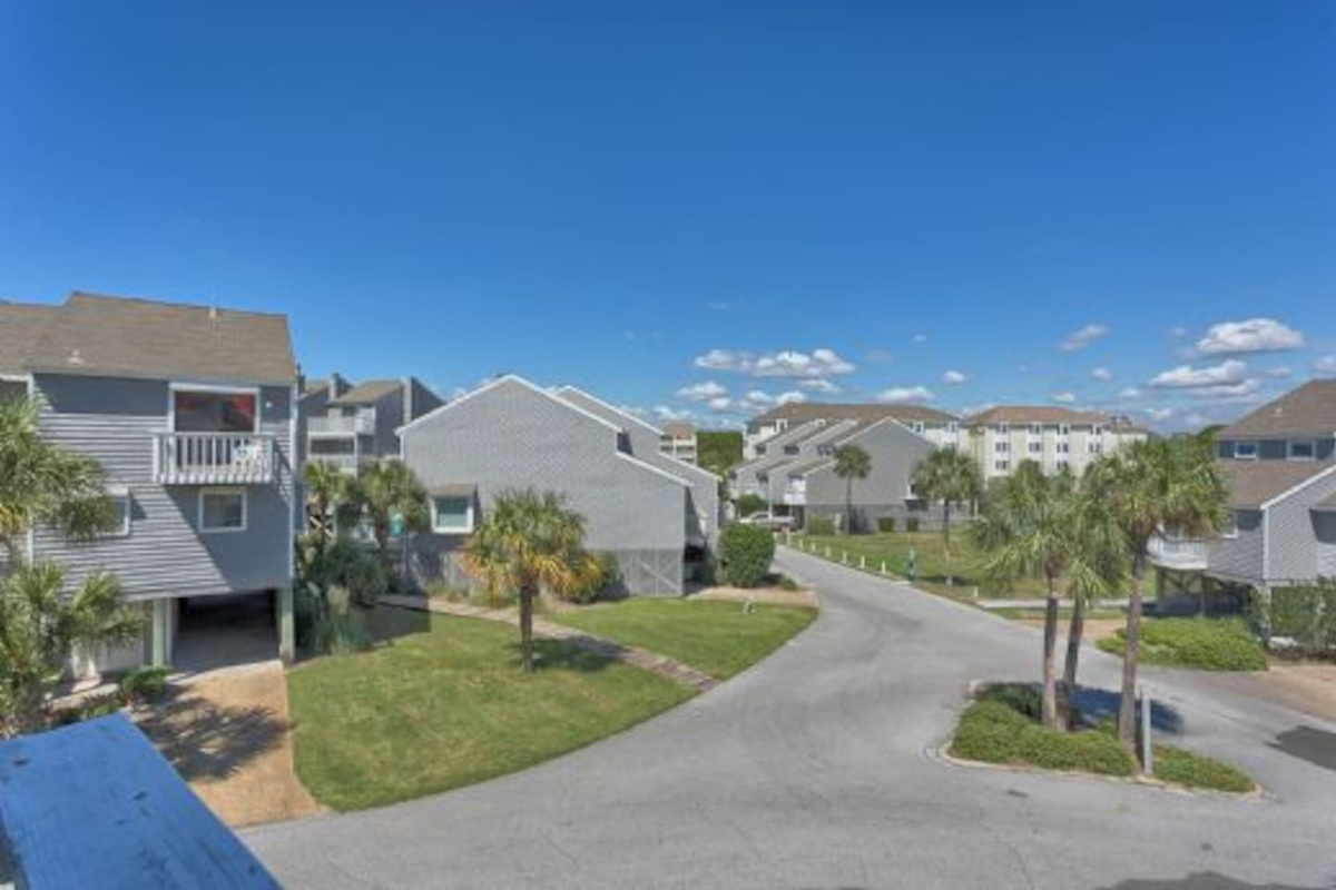 Drive straight in under the covered carport &mdash; two spots, shade, and the beach gear closet just steps away.