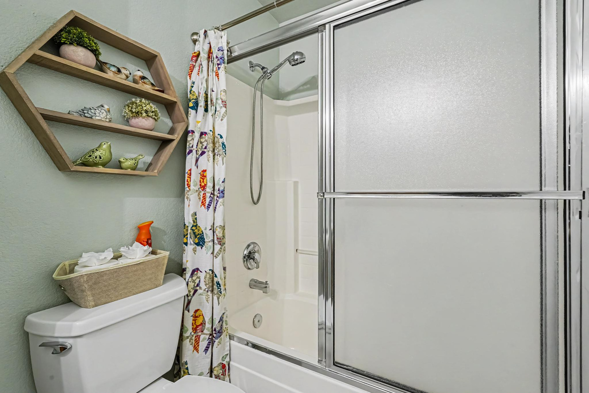 The main bathroom is thoughtfully stocked with everything you need for a comfortable stay. We provide shampoo, conditioner, body wash, plush toilet paper, and makeup washcloths for your convenience, so you can pack lighter and enjoy a relaxing experience.