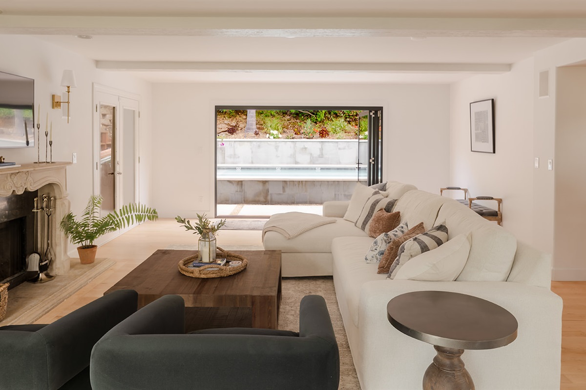 Comfortable Family Room Opens to the Pool