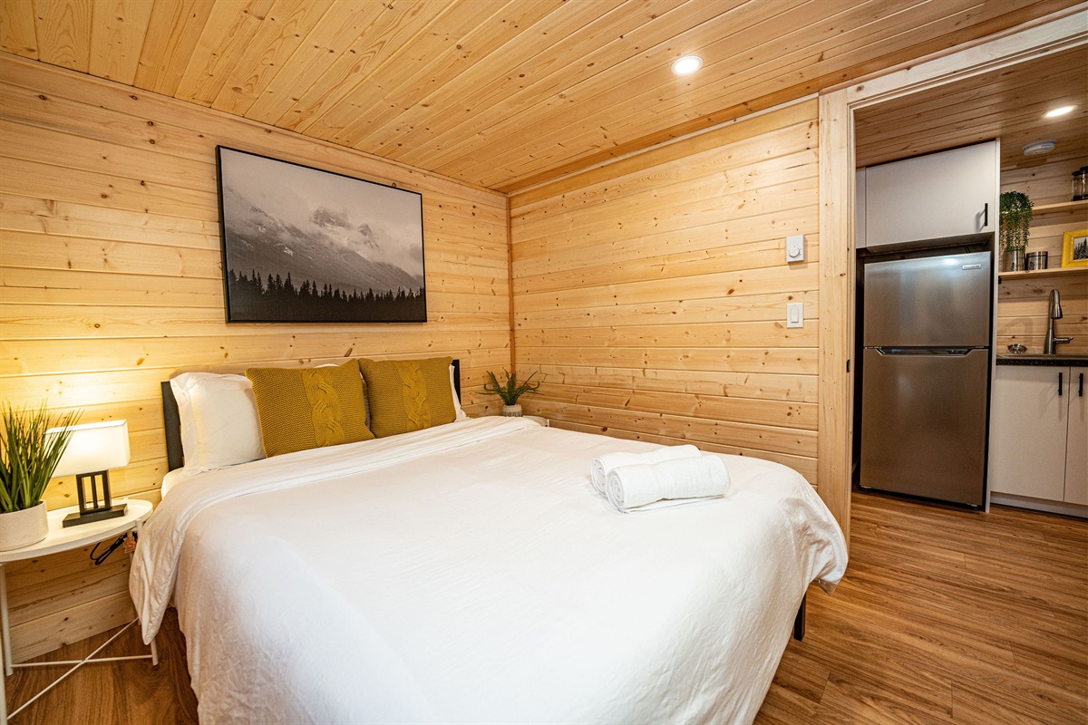 Lower bedroom with view into kitchen