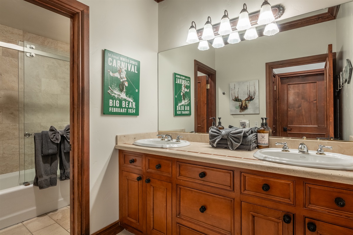 The Moose offers a shared hall bath serving the guest bedrooms, featuring a double vanity and a separate room for the tub/shower and toilet—ideal for busy mornings and group stays.