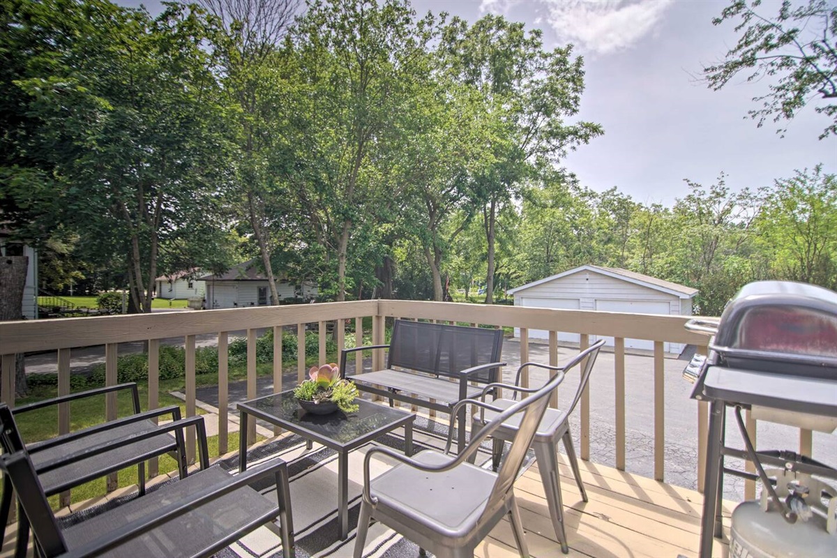 3Bd Unit:  Plenty of seating for six on your private deck, in the back yard overlooking the parking area and garage. 