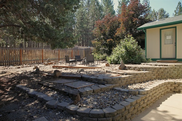 Fenced side yard has a firepit (can usually only be used in winter because of fire restrictions)