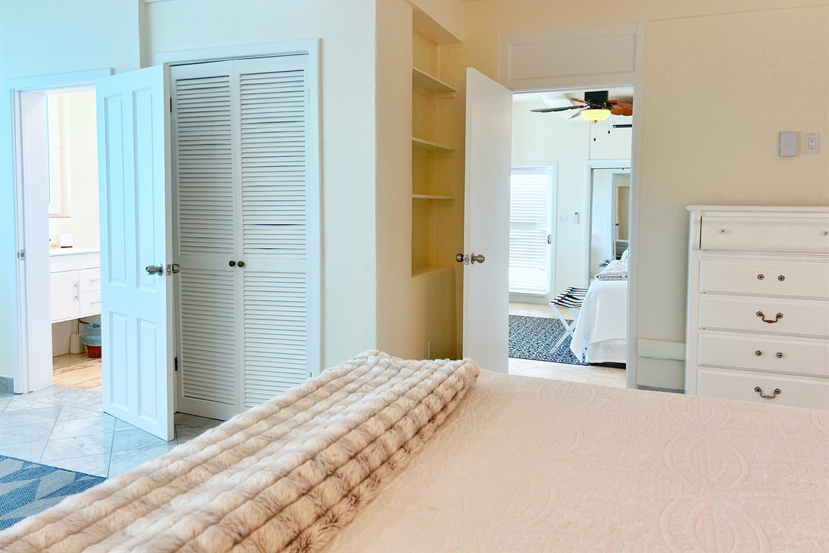 Bedroom combines soft d&eacute;cor with expansive outdoor access.