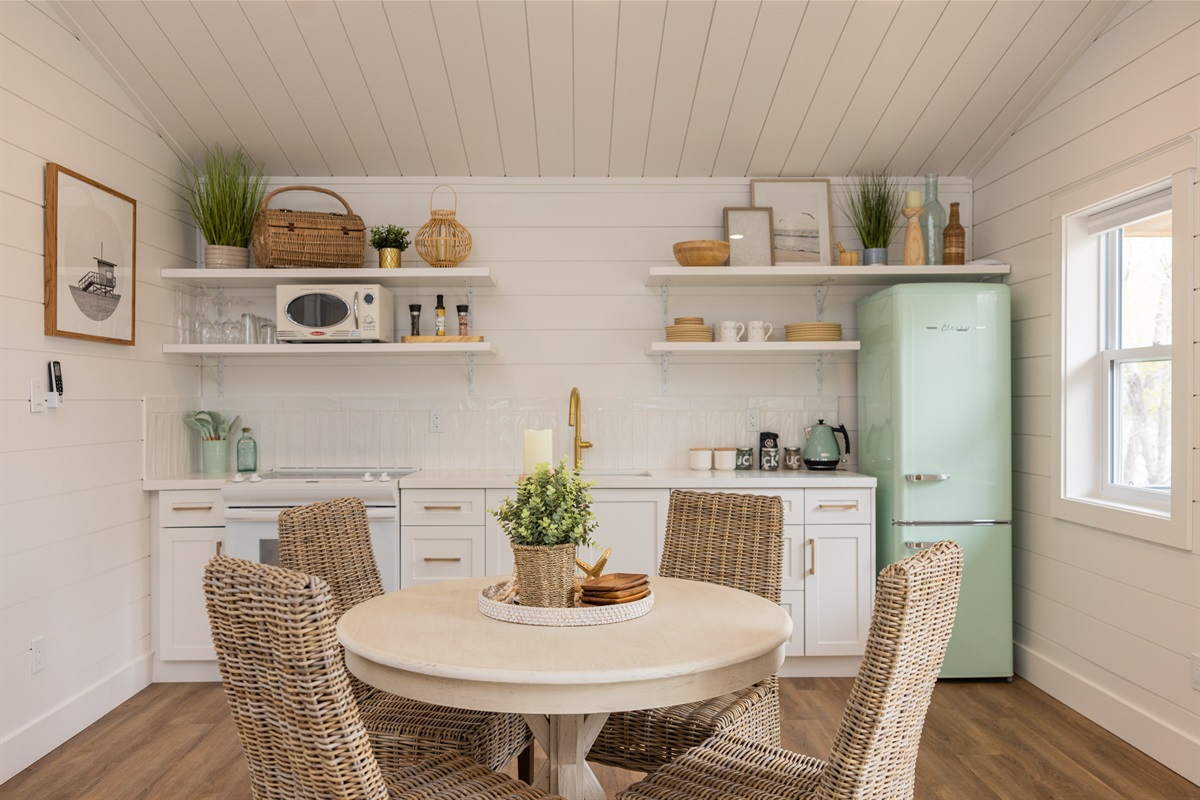 Step into a world of warmth and charm with this delightful small kitchen, nestled within a picturesque cottage. 