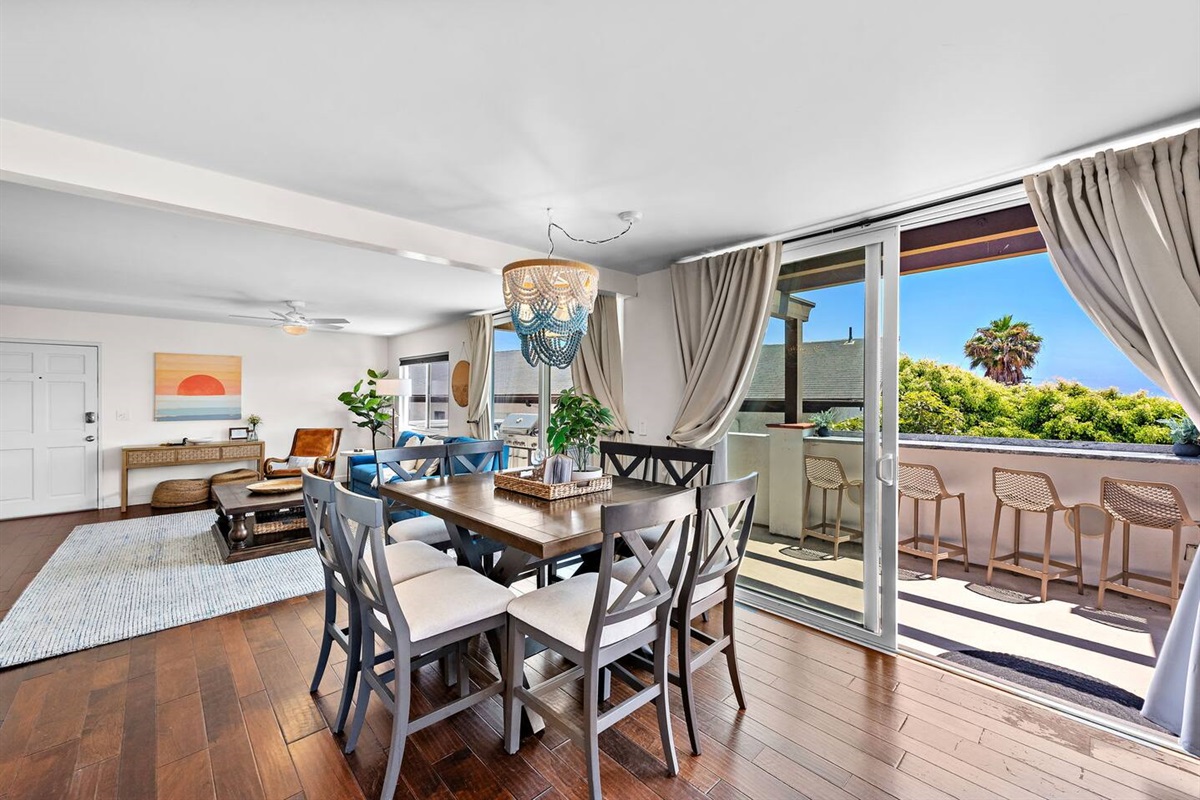 Open floor plan enables everyone to feel included even during meal prep :)  Plenty of seating inside and out.