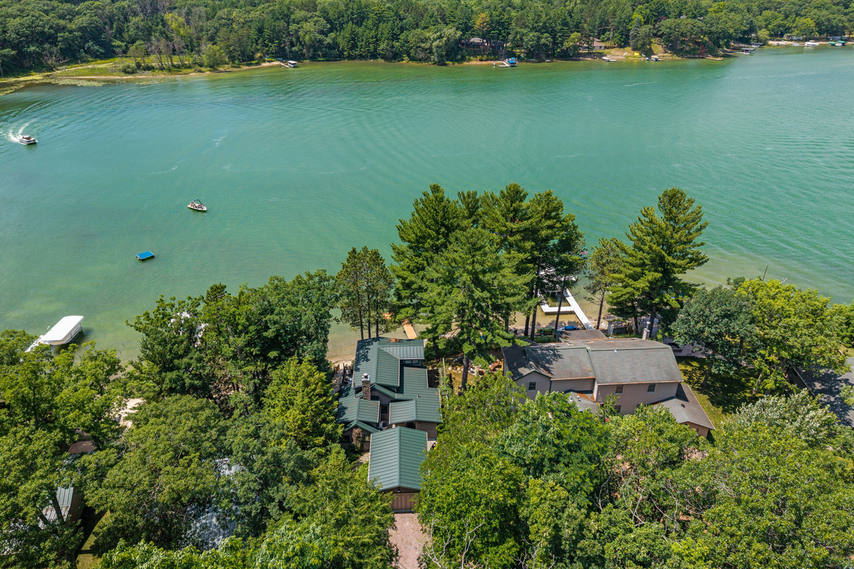 From above, you'll see everything that makes this getaway special—your cozy cottage, sandy shoreline, and beautiful waterfront setting.
