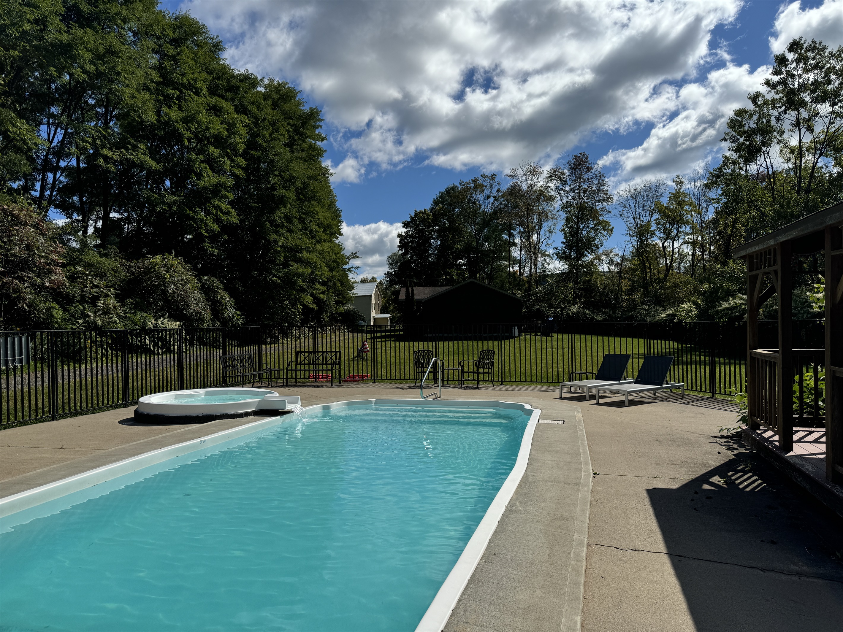 Shared pool area with Hope Mill House at end of driveway
