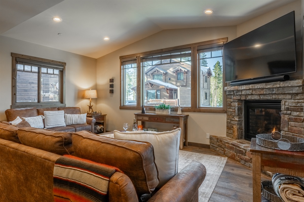 Spacious, sunlit, and designed for gathering — this inviting living area blends comfort, warmth, and modern mountain style.