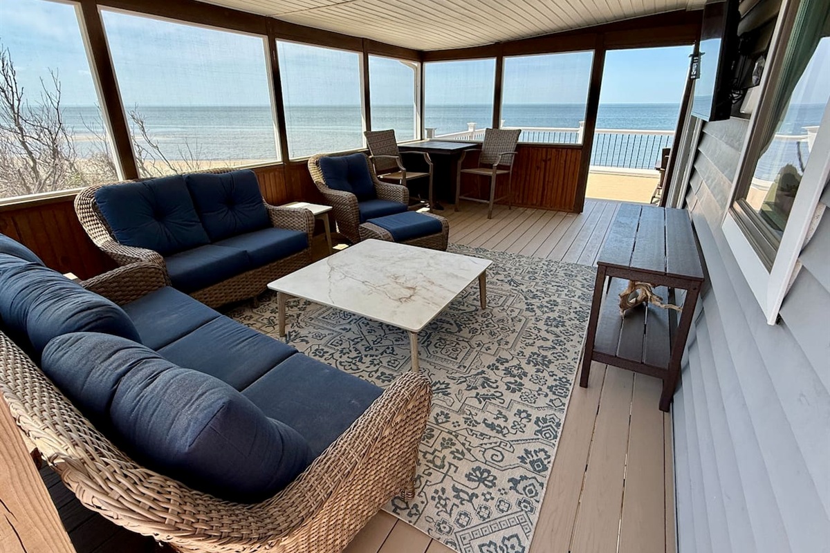 Unwind in this elegant screened-in porch, the ultimate luxury relaxation space. Featuring comfortable wicker seating and panoramic ocean views, it is the perfect spot to enjoy the coastal breeze in total comfort.