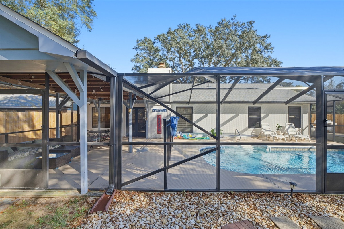 Enjoy outdoor living in this screened-in pool area, designed for both relaxation and entertainment. The enclosure provides comfort and privacy while allowing you to enjoy the sunshine and fresh air beside the sparkling pool.