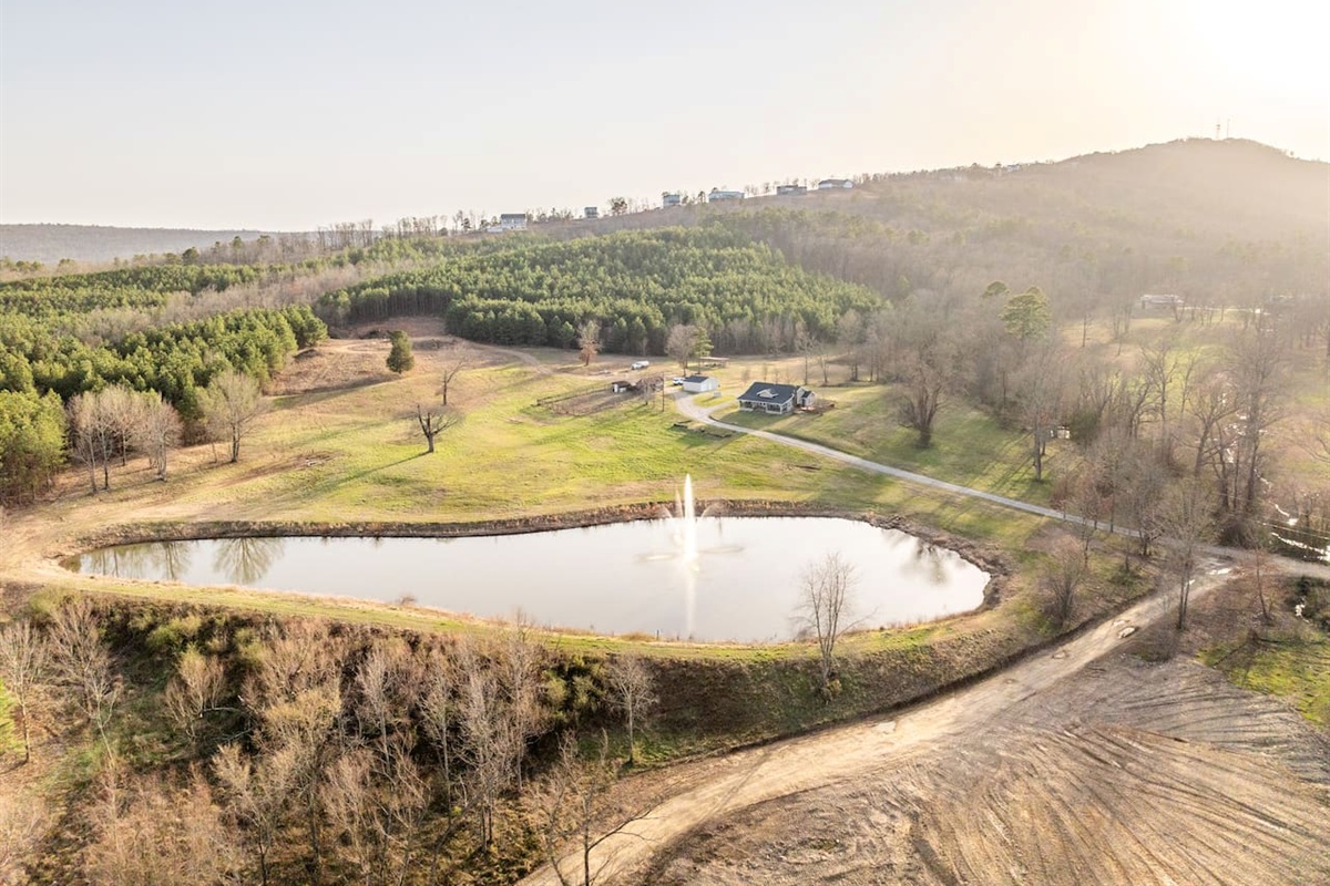 Scenic Retreat: Embrace nature's beauty by the tranquil pond and lush greenery!