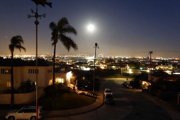 Full moon over the bay with a star above