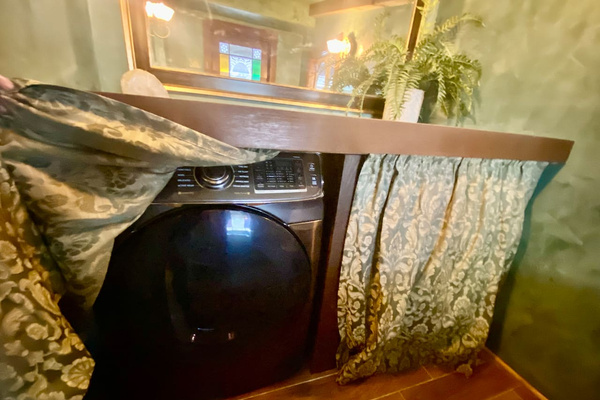 Planning a longer stay? Guests booked for five nights or more may use the full-size washer and dryer, discreetly tucked behind the Bath Annex curtain. Laundry supplies are provided, so you can pack a little lighter.

