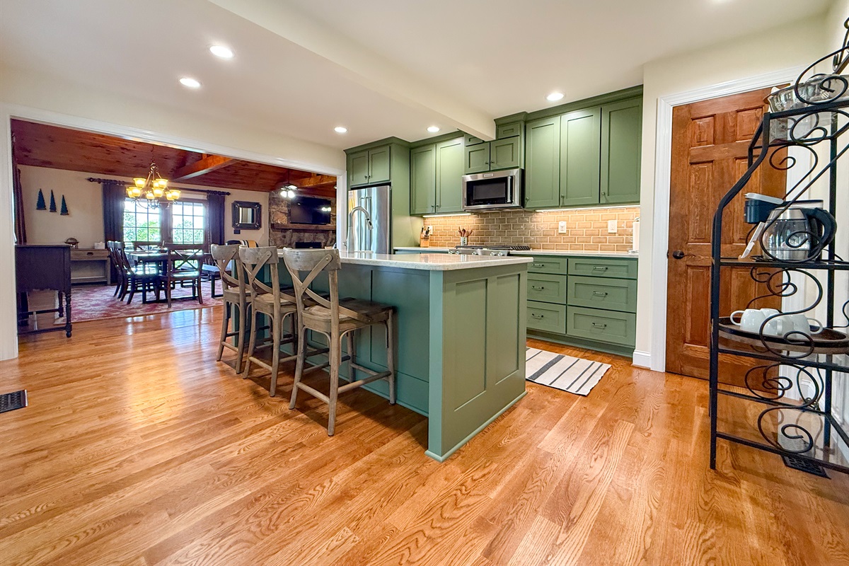 The open layout between the kitchen and living room keeps you connected to friends and family while you cook.