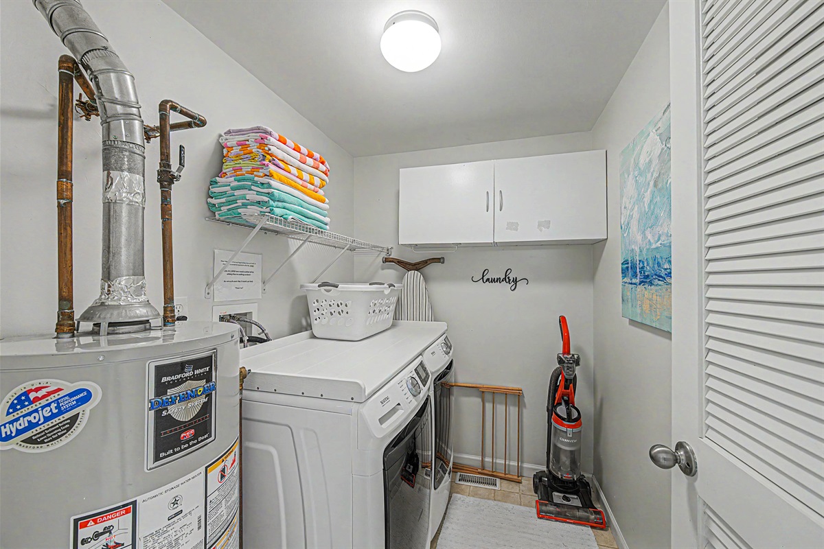 Laundry room with 10 beach towels, drying rack, iron